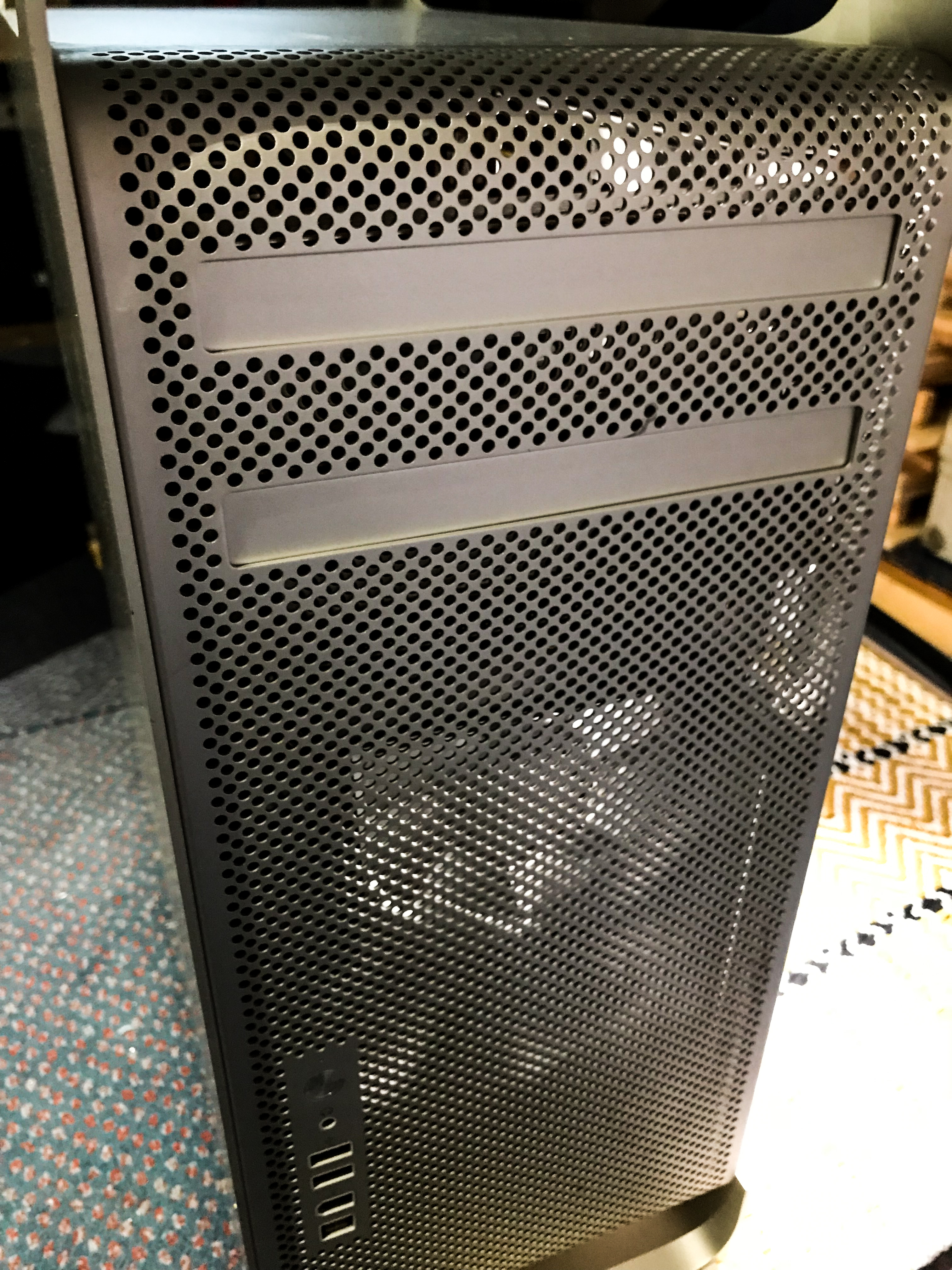 A picture of the front aspect of the rebuild 2008 MacPRo sitting on the floor.